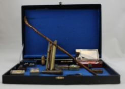 A collection of interesting items including silver cigarette holder , various pill boxes,