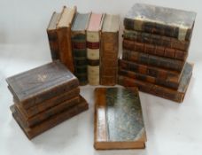 A collection of early 19th Century leather bound books including various Christianity,