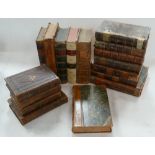 A collection of early 19th Century leather bound books including various Christianity,