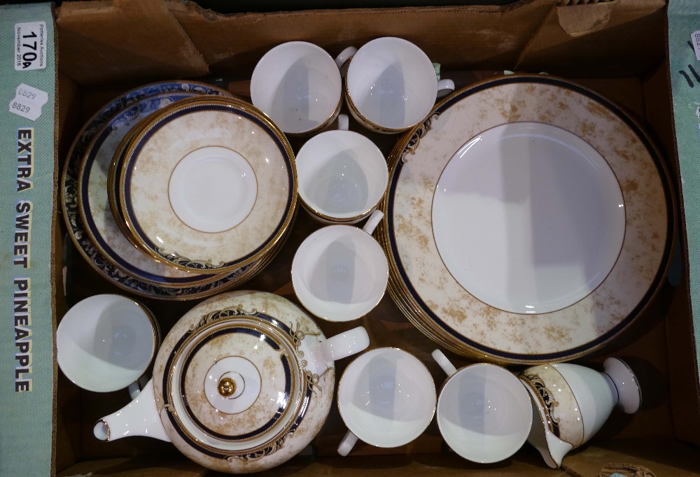 A collection of Wedgwood Cornucopia dinnerware to include cups, saucers, side plates, tea pot, etc.