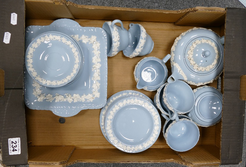 A collection of Wedgwood Queensware items to include teapot, cups, serving platters, saucers, etc.