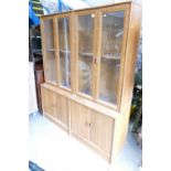 Glass fronted walnut display cabinet, comprising of 4 sections.