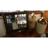 Oak old charm swivel dressing table mirror and two stoneware flagons.