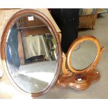 Oval mirror and dressing table mirror on stand.