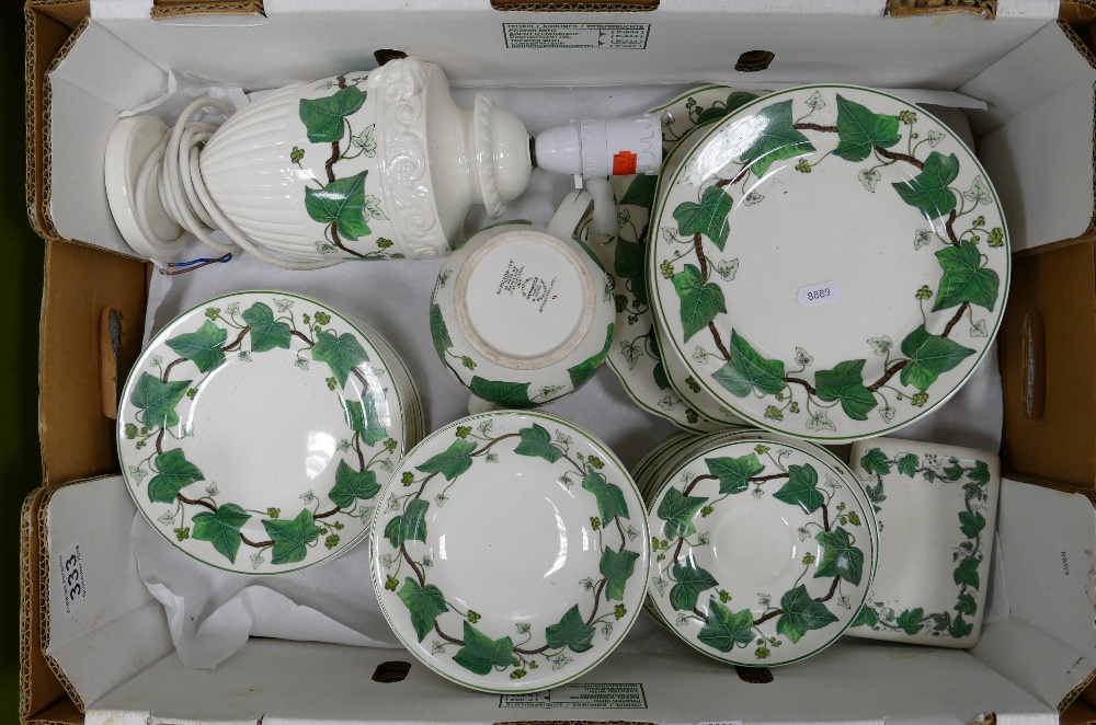 A collection of Wedgwood dinnerware in the Napoleon ivory design to include dinner plates,