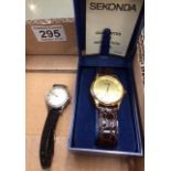 Gents Sekonda quartz wristwatch with leather strap in plastic original box and Timex steel