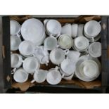 A collection of unmarked undecorated china teaware.