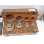 Cased set of brass weights