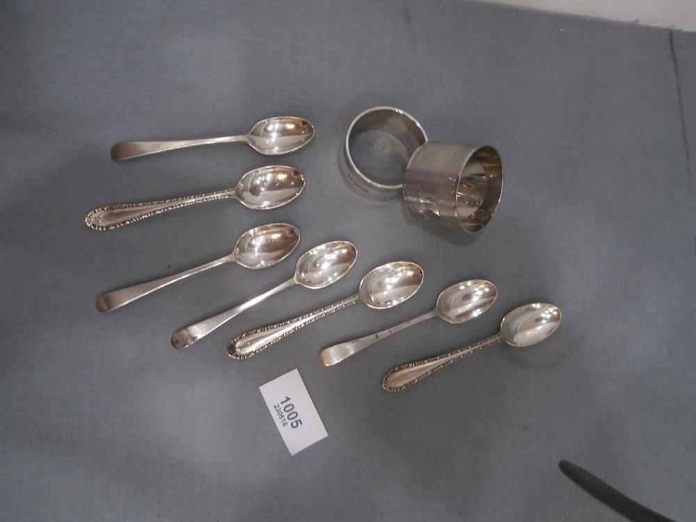 7 Silver teaspoons and 2 silver napkin rings 6oz