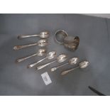 7 Silver teaspoons and 2 silver napkin rings 6oz