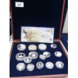 Cased Containing a collection of silver proof coins incl. 1 pounds, Royal Commemorative etc.