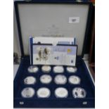 Cased collection of 12 Commemorative silver proof coins all relating to QEII