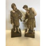 A pair of Victorian Austrian porcelain figurines modelled as bearded cloaked figures, mounted on