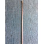 A carved tribal waking staff, the heavy tapering stick with geometrically carved handle. (48in)