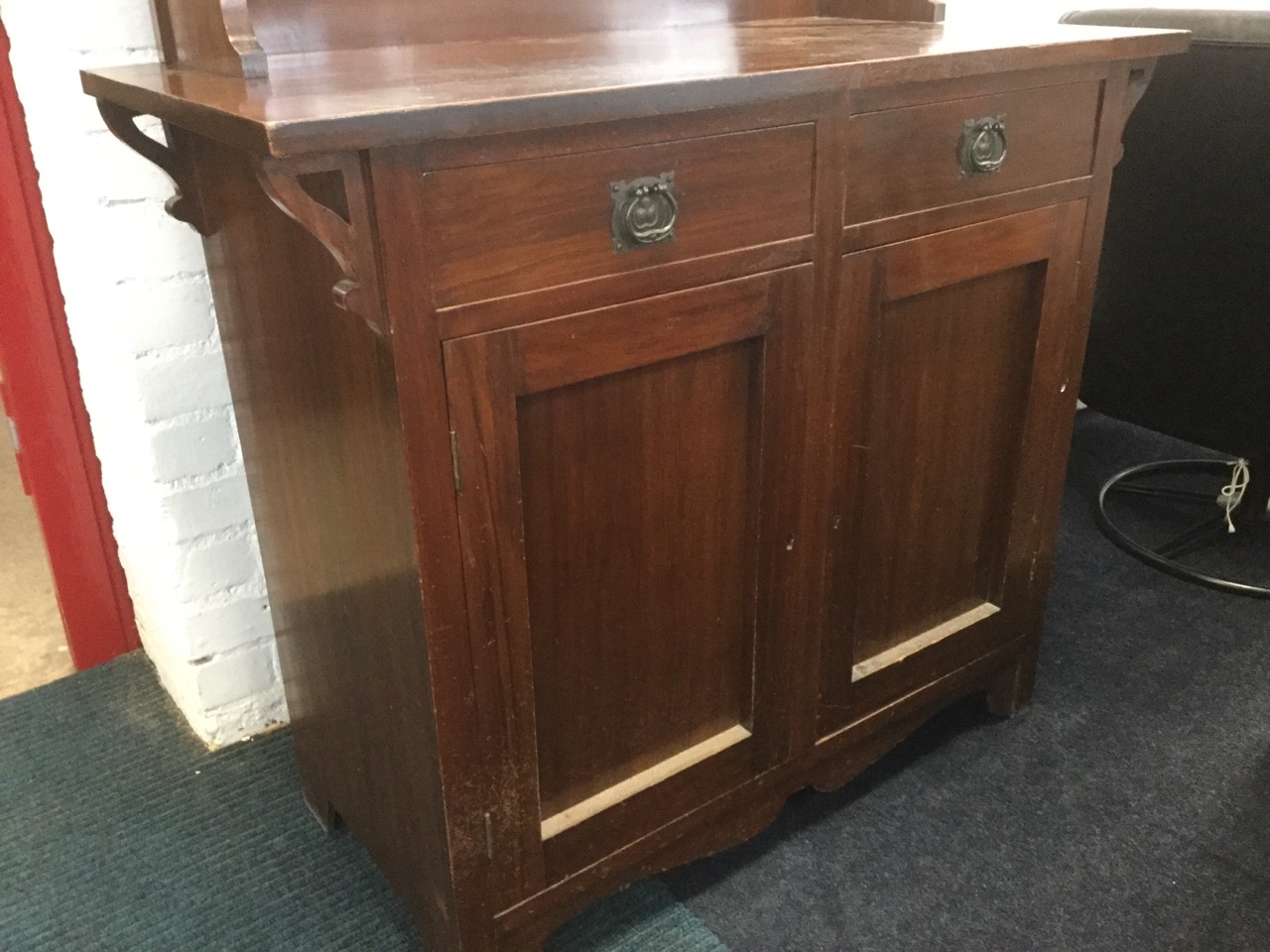 An art nouveau walnut sideboard, with overhanging cornice on pierced supports above a bevelled - Image 3 of 3