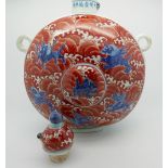 A large Chinese moonflask with domed stopper of bulbous form, decorated in blue & red with
