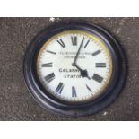 An Edwardian cast iron railway clock from Galashiels Station, the circular moulded frame with