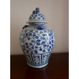 A large Chinese blue & white potted vase and cover with dog finial, the shoulders with three dog