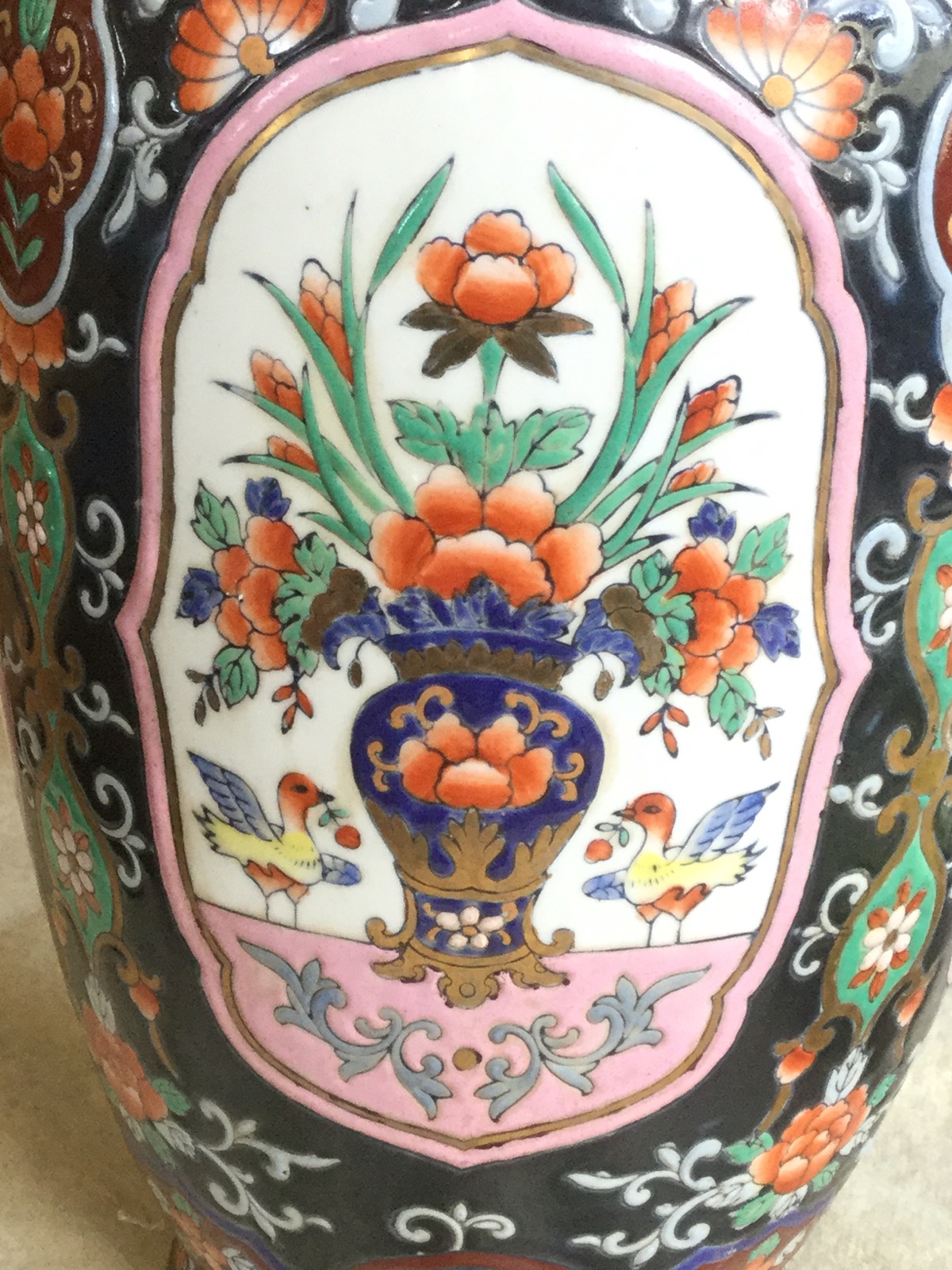 A Cantonese Imari style lidded jar with matching tapering vase, decorated with floral panels of - Image 3 of 3