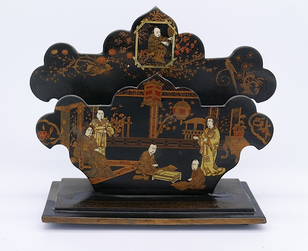 A hand-painted chinoiserie letter laquered rack, the two fretwork cut panels decorated with