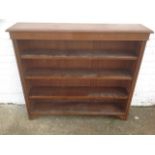 An Edwardian oak open bookcase, the moulded top above a plain frieze and three adjustable shelves