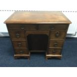 A Georgian mahogany kneehole desk, having rectangular moulded top above two frieze drawers, the