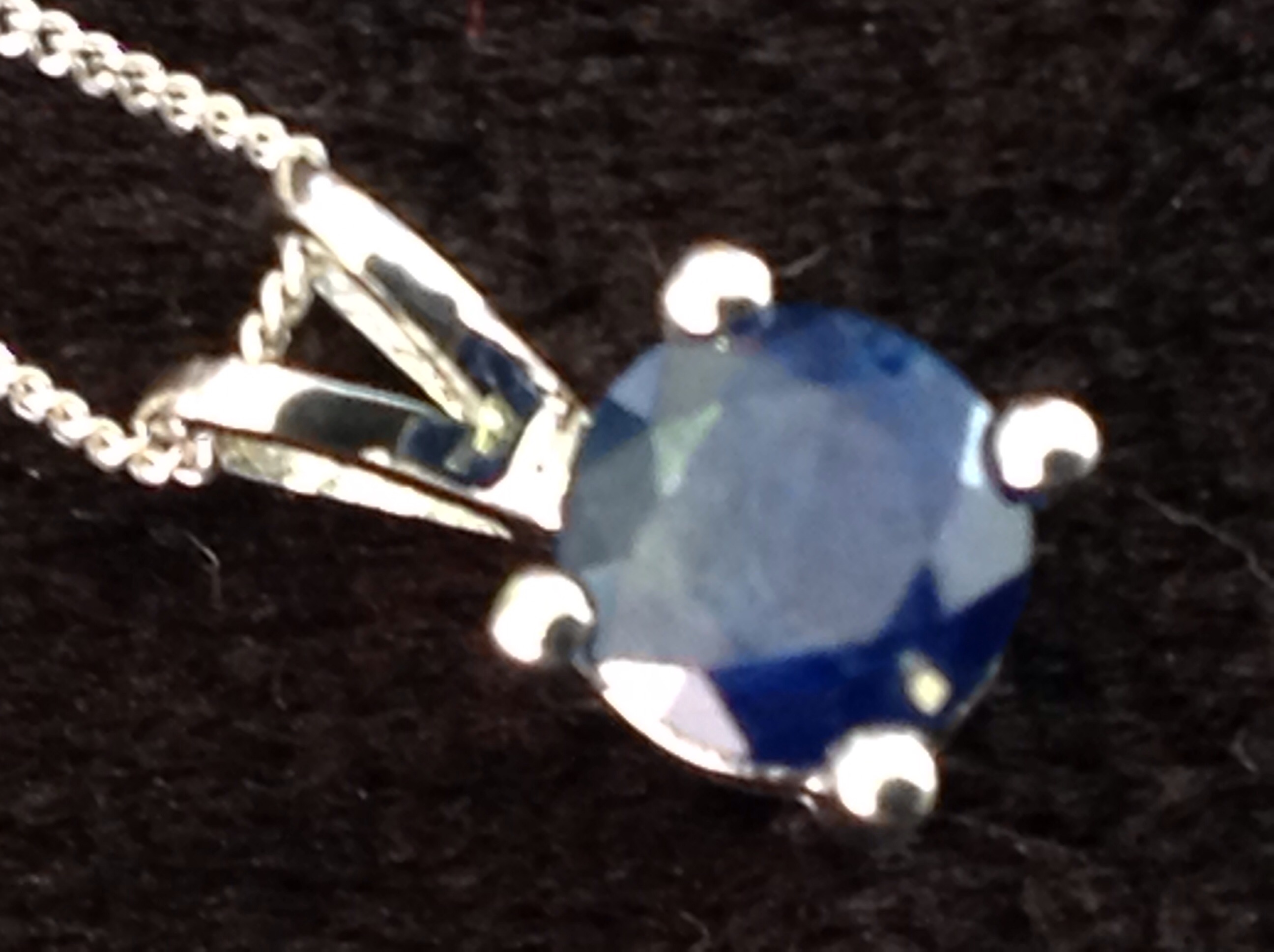 An 18ct white gold single stone sapphire pendant, the claw set stone on a fine chain weighing - Image 2 of 3