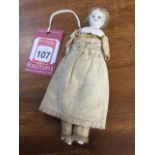 An early nineteenth century doll, with hand-painted porcelain head on sawdust stuffed body,