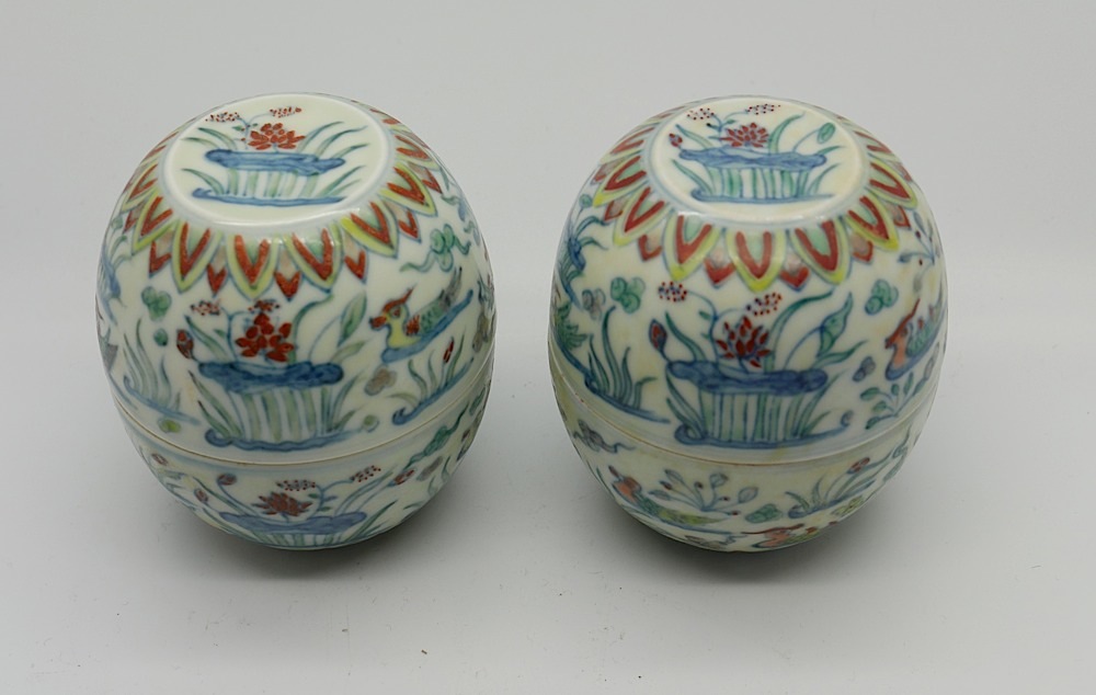 A set of four Chinese doucai interlocking cups, with six character Chenghua mark to bases, decorated