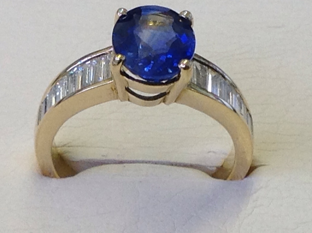 An 18ct yellow gold Madagascan oval sapphire & baguette cut diamond ring, the oval claw set sapphire - Image 3 of 3