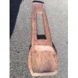 A chisel carved hardwood shovel, the bowl framed by border of diagonal cut lines, with hollow