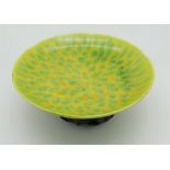 A Chinese yellow & green decorated hexagonal scalloped dish on footed base, with green brushwork