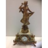 An art nouveau French mantleclock, surmounted by a classical lady after Moreau titled Symphonie