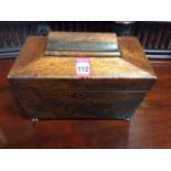A nineteenth century rosewood tea caddy of sarcophagus form, having interior with twin