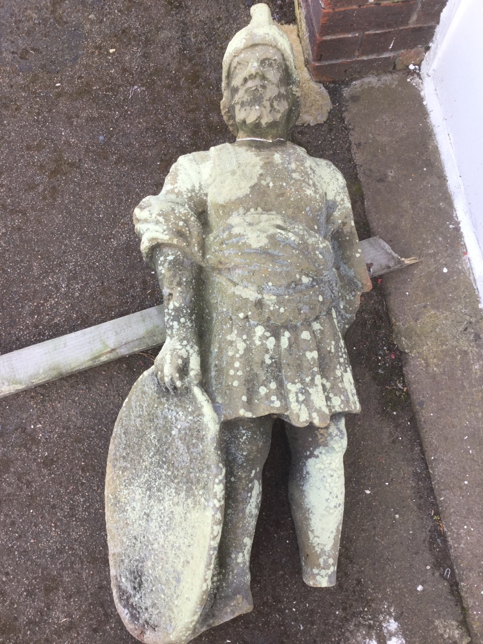 An eighteenth century carved stone soldier removed from the Alnwick Castle battlements, the