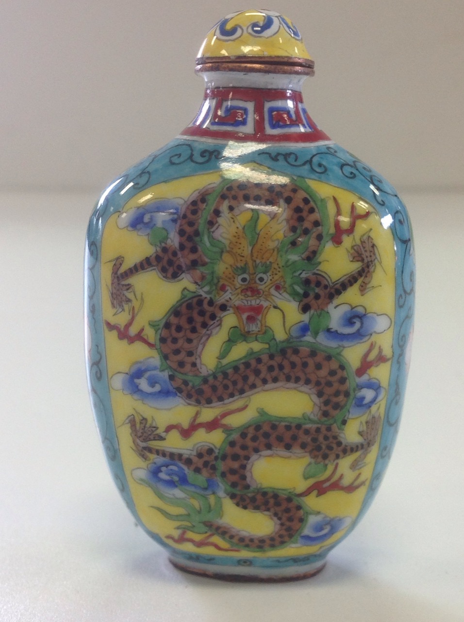 An interior painted Chinese glass snuff bottle of baluster shape, mounted with trailing green - Image 2 of 3