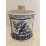 A Chinese blue & white tubular waisted jar, decorated with two panels of birds & foliage on