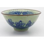 A Chinese crackle glazed heavilly potted bowl decorated with a naked maiden seated on a mat, with