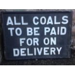 A rectangular instructional sign, the raised lettering in wood frame - All Coals to be Paid For. (