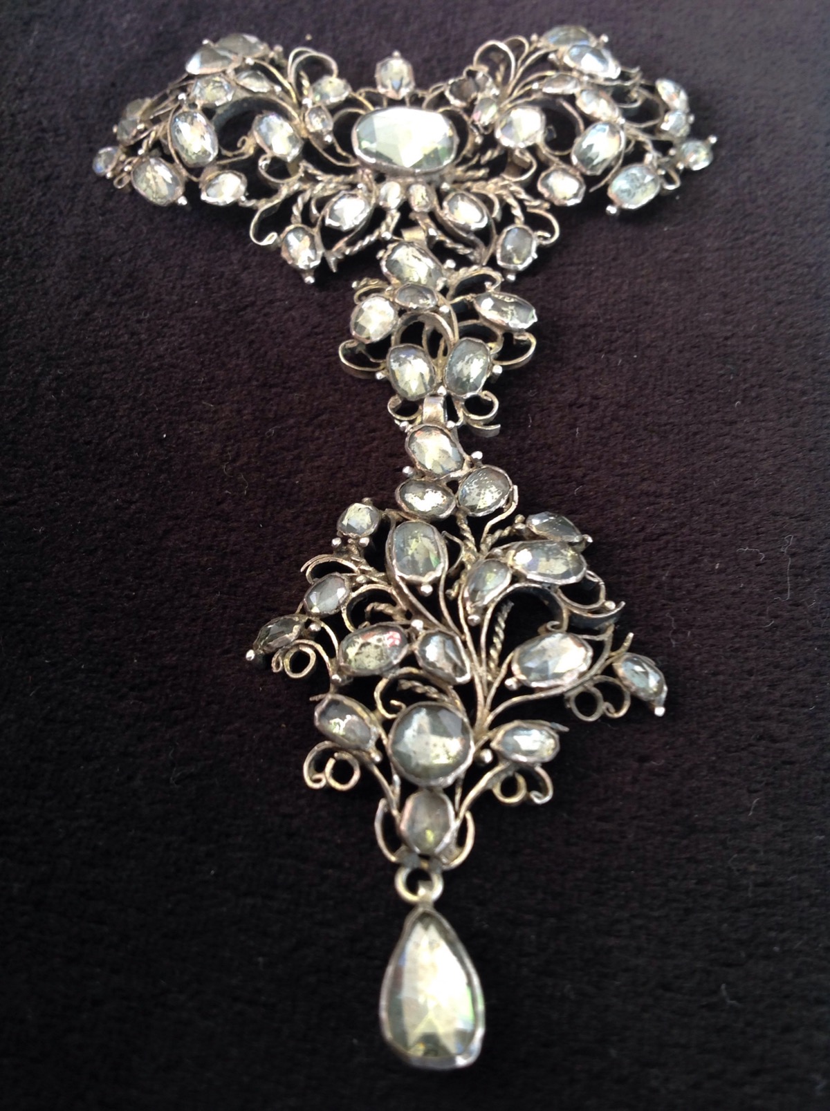 An antique belle Èpoque brooch/pendant stomacher, the antique piece in the form of spray foliate