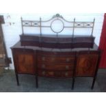 A late Victorian Adams style mahogany sideboard by Robson of Newcastle, the back with brass rails