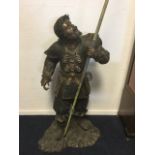 Bronze, bearded soldier in armoured dress, possibly Japanese, holding later javelin, standing on