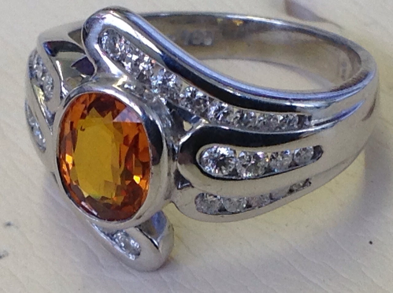 An 18ct gold oval yellow sapphire & diamond crossover ring, the central bezel set stone of 1.42 - Image 3 of 3