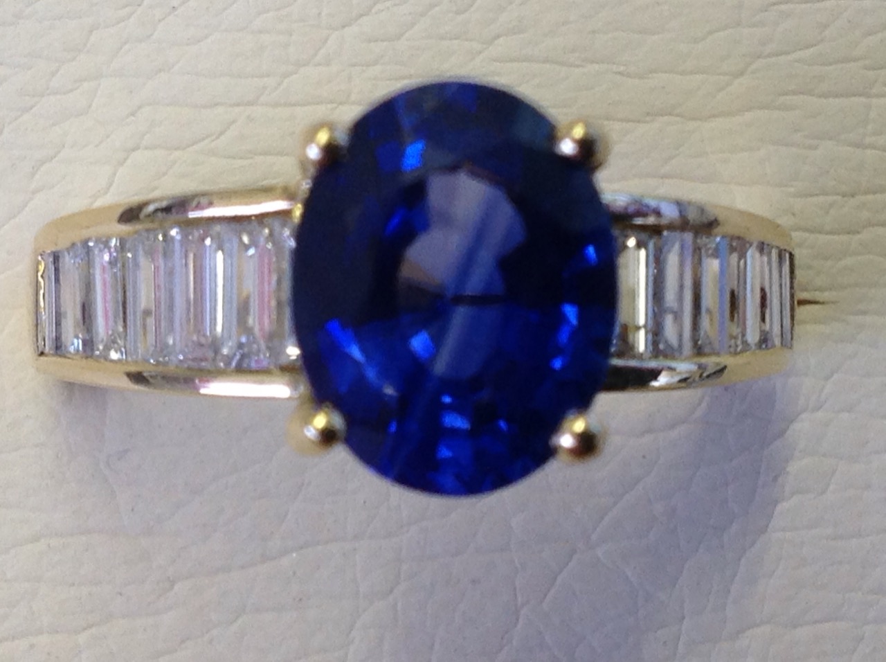 An 18ct yellow gold Madagascan oval sapphire & baguette cut diamond ring, the oval claw set sapphire - Image 2 of 3