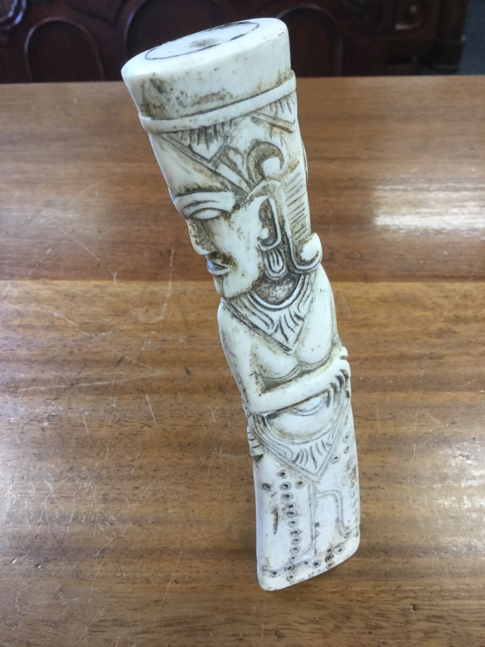 A carved horn figure, the piece dividing at waist to form a pot, the female with stylised eastern