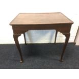 A Georgian mahogany silver table, the rectangular single piece tray top above shaped aprons,