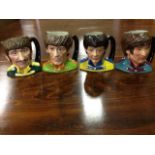 A set of four Royal Doulton Beatles toby jugs - Ringo, Paul, George and John, modelled by Stanley