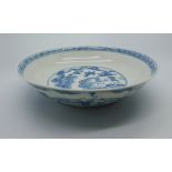 A Chinese blue & white dish decorated to central panel with two figures in landscape beneath