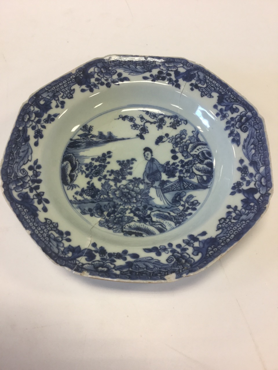 An octagonal nineteenth century Chinese porcelain blue & white bowl, decorated with figure in garden