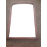 A large Victorian mahogany framed mirror, the rounded moulded frame formerly from a dressing